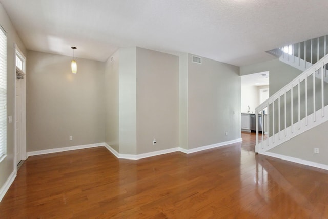 155 Waterford Dr, Jupiter, FL 33458 - spare room with wood finished floors, baseboards, and stairs