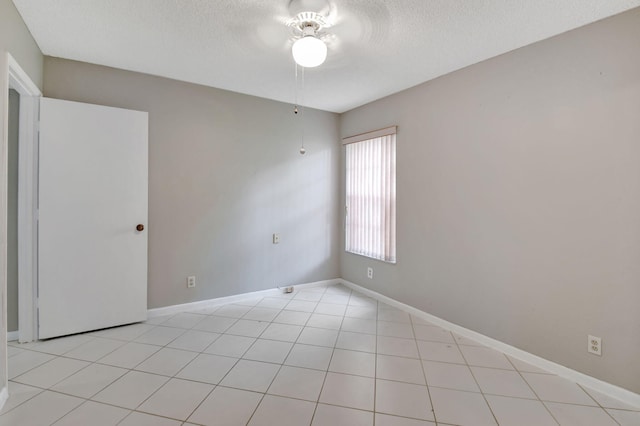 7300 Amberly Ln Unit 101, Delray Beach, FL 33446 - spare room featuring baseboards, a textured ceiling, and a ceiling fan
