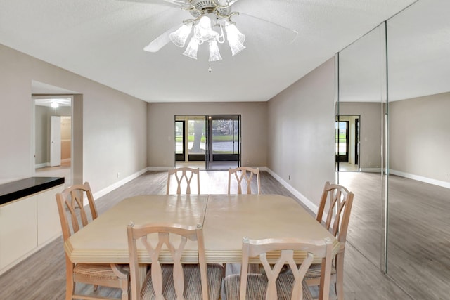 7300 Amberly Ln Unit 101, Delray Beach, FL 33446 - dining area with baseboards, light wood-type flooring, and a ceiling fan