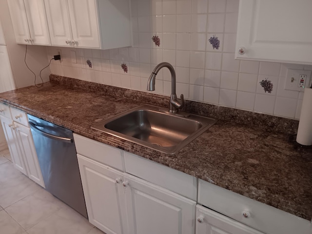 3450 Blue Lake Dr Unit 204, Pompano Beach, FL 33064 - kitchen featuring white cabinets, dark stone counters, decorative backsplash, stainless steel dishwasher, and a sink