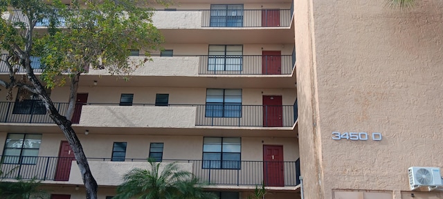3450 Blue Lake Dr Unit 204, Pompano Beach, FL 33064 - view of building exterior featuring ac unit