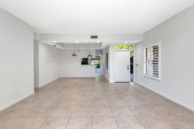 7857 Lexington Club Blvd Unit A, Delray Beach, FL 33446 - unfurnished living room with baseboards, visible vents, and light tile patterned floors