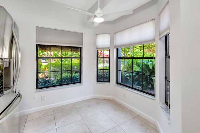 7857 Lexington Club Blvd Unit A, Delray Beach, FL 33446 - unfurnished room featuring light tile patterned floors, ceiling fan, and a healthy amount of sunlight