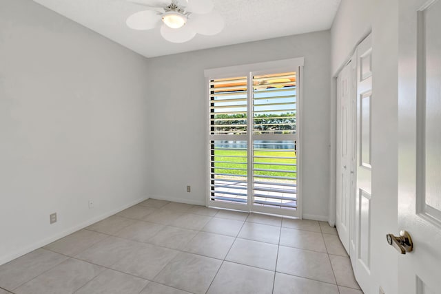 7857 Lexington Club Blvd Unit A, Delray Beach, FL 33446 - spare room with baseboards and light tile patterned flooring