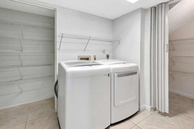 7857 Lexington Club Blvd Unit A, Delray Beach, FL 33446 - clothes washing area with laundry area, light tile patterned floors, and washing machine and clothes dryer