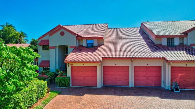 7857 Lexington Club Blvd Unit A, Delray Beach, FL 33446 - view of front of house featuring stucco siding and a tile roof