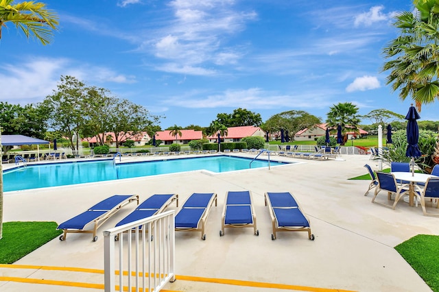 7857 Lexington Club Blvd Unit A, Delray Beach, FL 33446 - pool featuring fence and a patio area