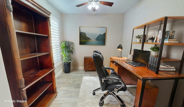 9525 SW Royal Poinciana Dr, Port Saint Lucie, FL 34987 - office space featuring baseboards, wood finished floors, and a ceiling fan