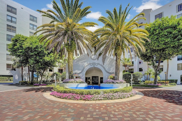 view of building exterior featuring curved driveway