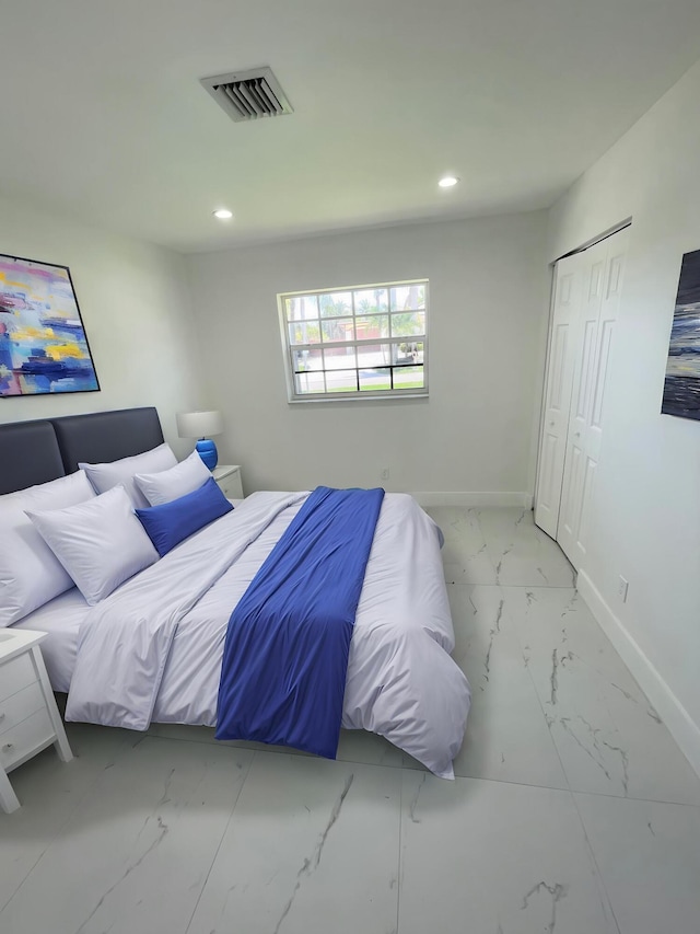 6887 Osborne Dr, Lake Worth, FL 33462 - bedroom with marble look tiles, baseboards, recessed lighting, and a closet