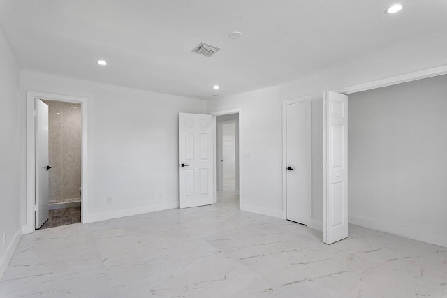 6887 Osborne Dr, Lake Worth, FL 33462 - unfurnished bedroom featuring marble finish flooring, recessed lighting, baseboards, and connected bathroom