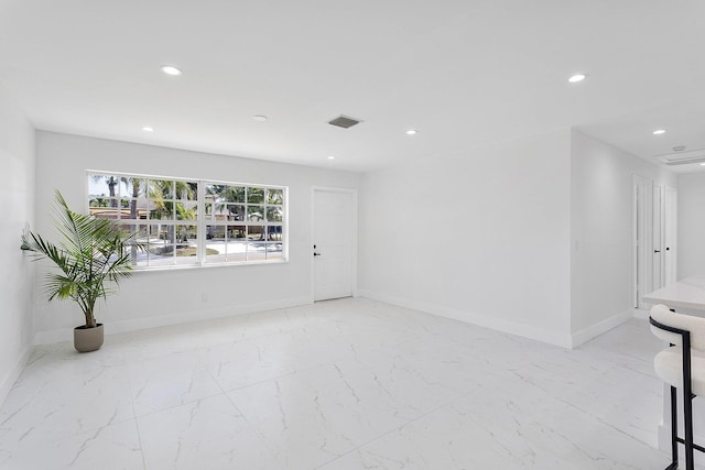 6887 Osborne Dr, Lake Worth, FL 33462 - unfurnished room with recessed lighting, marble finish flooring, and baseboards