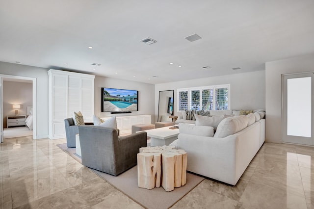 living area with marble finish floor, recessed lighting, and visible vents