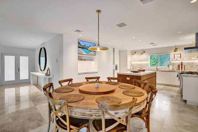 dining area with french doors, visible vents, and recessed lighting
