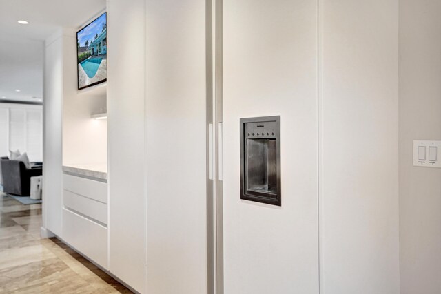 hall featuring recessed lighting