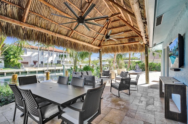 view of patio / terrace with outdoor lounge area, a gazebo, outdoor dining area, and ceiling fan
