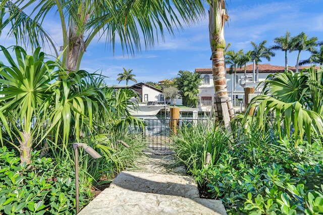 view of home's community featuring fence