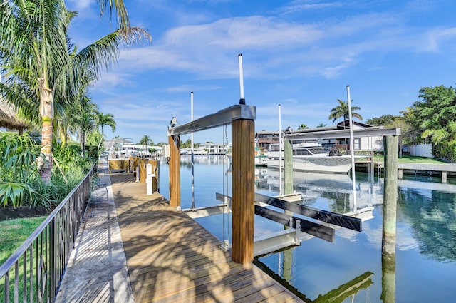 view of dock with a water view and boat lift