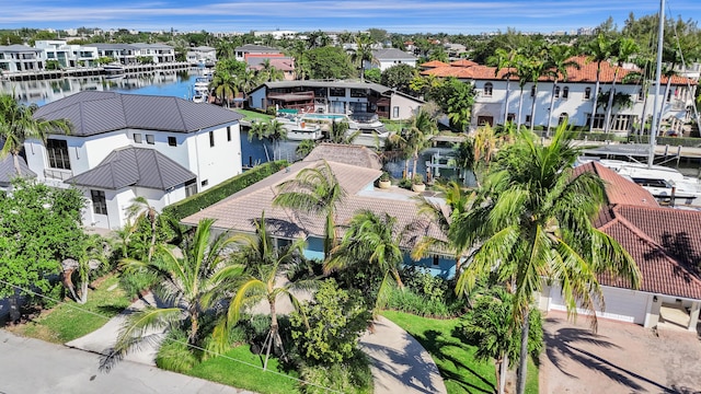 bird's eye view featuring a water view and a residential view