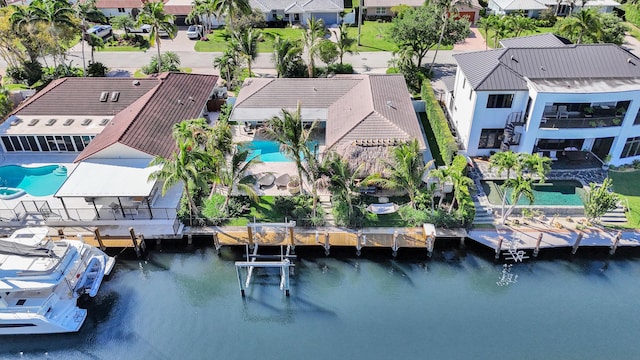 aerial view featuring a residential view and a water view