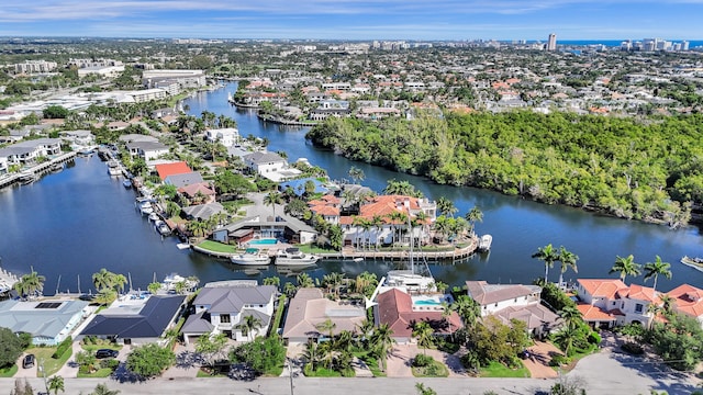 birds eye view of property with a water view and a residential view