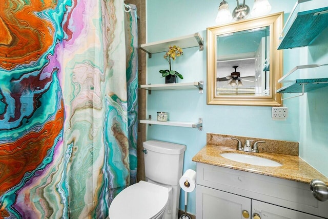 full bath featuring toilet, vanity, and ceiling fan