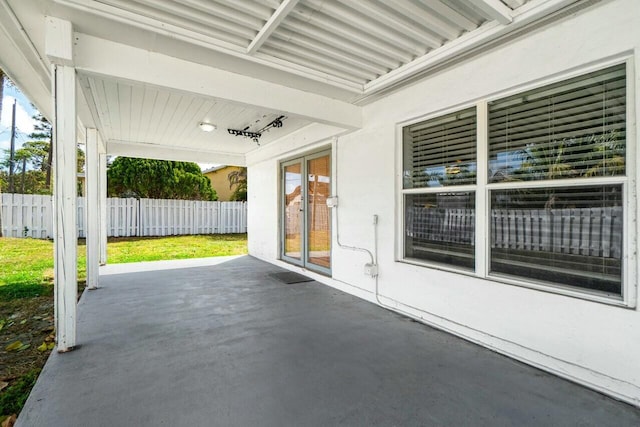 view of patio featuring fence