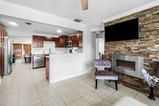 interior space with light tile patterned floors, visible vents, and ornamental molding