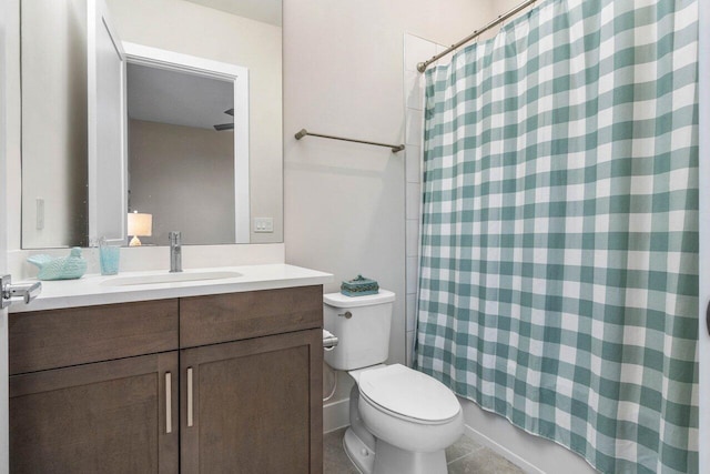 bathroom featuring vanity, tile patterned floors, toilet, and shower / bath combo with shower curtain