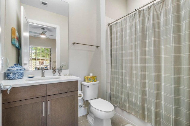 bathroom featuring vanity, a ceiling fan, visible vents, shower / bath combo, and toilet
