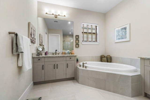 bathroom with tile patterned flooring, a stall shower, vanity, and a bath