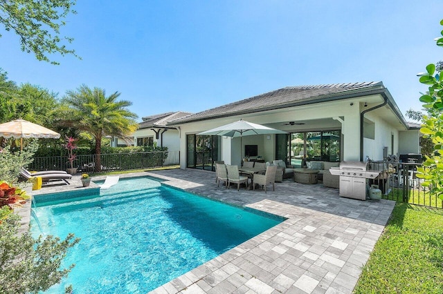 view of pool with a patio, fence, a fenced in pool, outdoor lounge area, and a grill