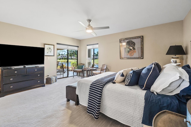 bedroom with a ceiling fan, carpet, and access to outside