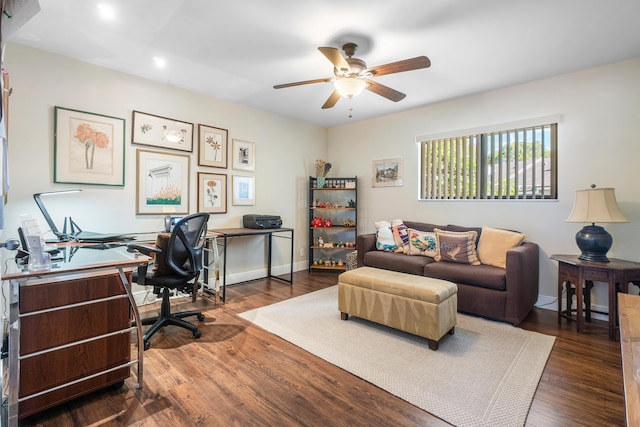 office space with baseboards, wood finished floors, and a ceiling fan