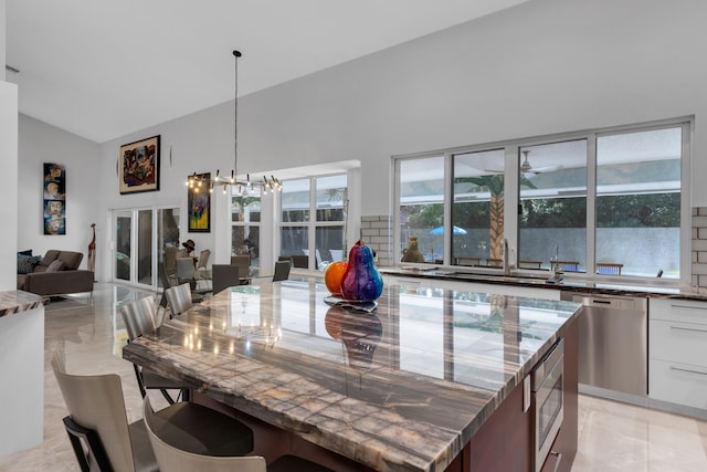 17888 Fieldbrook Cir W, Boca Raton, FL 33496 - dining area featuring lofted ceiling and a chandelier