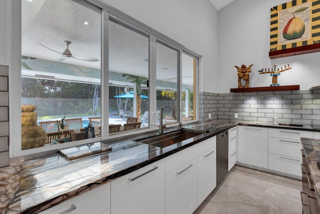 17888 Fieldbrook Cir W, Boca Raton, FL 33496 - kitchen with a sink, healthy amount of natural light, ceiling fan, and tasteful backsplash