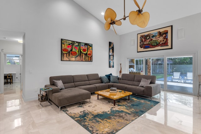 17888 Fieldbrook Cir W, Boca Raton, FL 33496 - living area featuring light marble finish floors, high vaulted ceiling, and baseboards