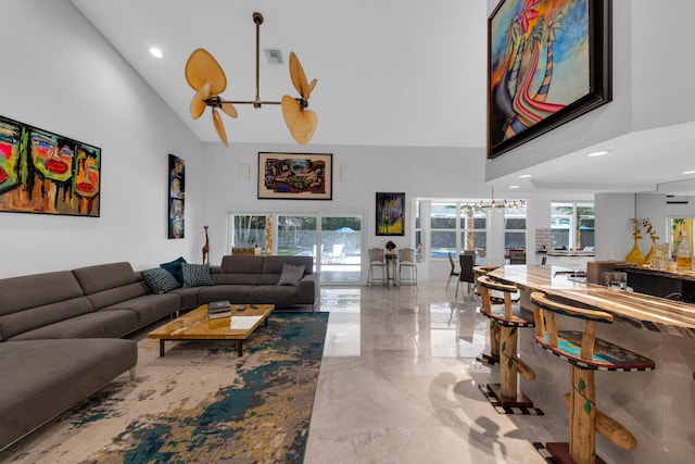 17888 Fieldbrook Cir W, Boca Raton, FL 33496 - living room featuring high vaulted ceiling, marble tiled flooring, a chandelier, and recessed lighting