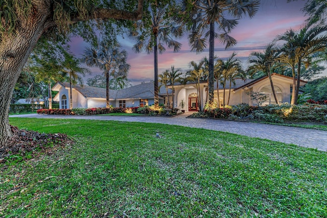 17888 Fieldbrook Cir W, Boca Raton, FL 33496 - mediterranean / spanish-style house with stucco siding, a yard, and curved driveway