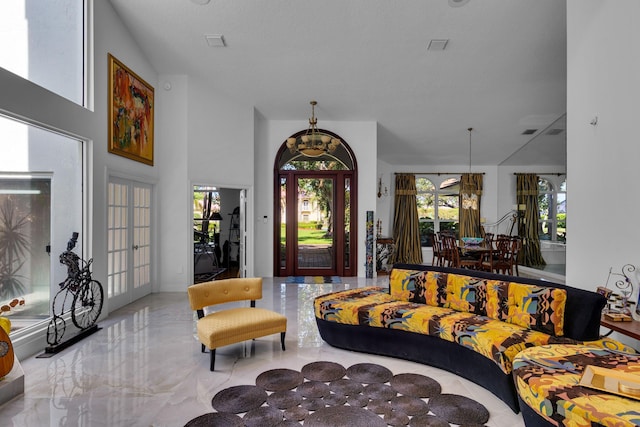 17888 Fieldbrook Cir W, Boca Raton, FL 33496 - living room with healthy amount of natural light and marble tiled floors