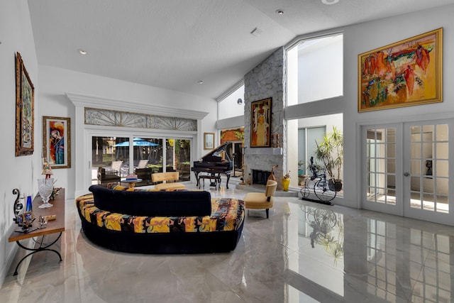 17888 Fieldbrook Cir W, Boca Raton, FL 33496 - living room with french doors, a stone fireplace, high vaulted ceiling, a textured ceiling, and marble tiled floors