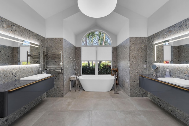 17888 Fieldbrook Cir W, Boca Raton, FL 33496 - full bathroom with tile walls, a freestanding tub, lofted ceiling, and vanity