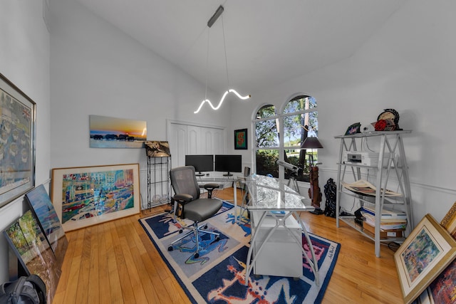 17888 Fieldbrook Cir W, Boca Raton, FL 33496 - office space featuring high vaulted ceiling, wood finished floors, and a chandelier