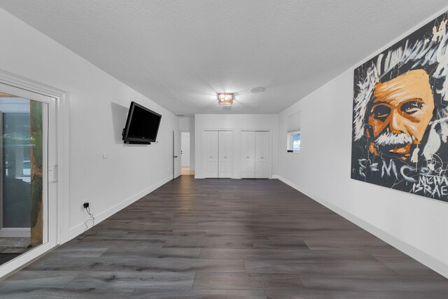 17888 Fieldbrook Cir W, Boca Raton, FL 33496 - foyer with a textured ceiling, dark wood-style flooring, and baseboards