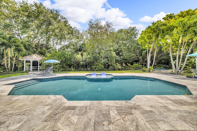 17888 Fieldbrook Cir W, Boca Raton, FL 33496 - outdoor pool with a gazebo, a patio area, and view of wooded area