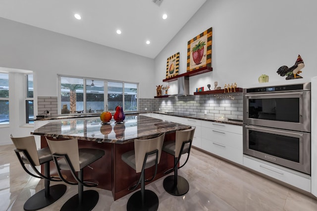 17888 Fieldbrook Cir W, Boca Raton, FL 33496 - kitchen featuring stainless steel double oven, modern cabinets, white cabinets, black electric cooktop, and recessed lighting