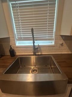 room details with a sink and decorative backsplash