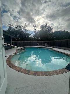 view of pool featuring a fenced in pool and fence