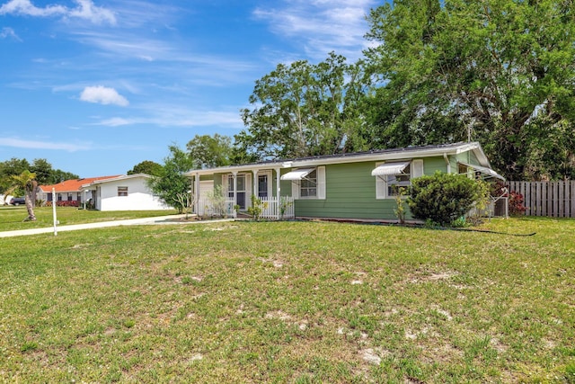 775 Sandia Ave, Port Saint Lucie, FL 34983 - ranch-style house with a front yard, fence, and an attached garage