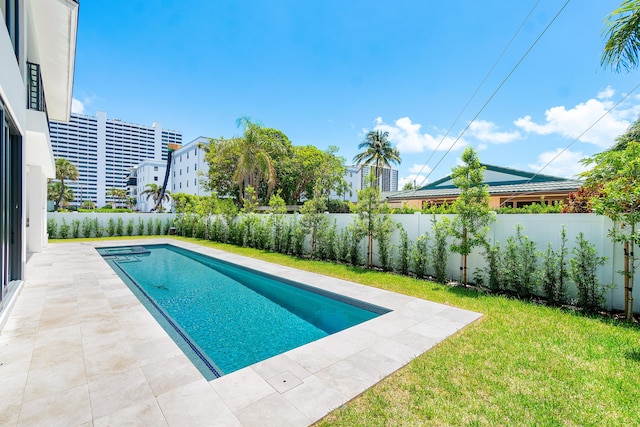 368 Churchill Rd, West Palm Beach, FL 33405 - view of swimming pool with a fenced in pool, a lawn, a fenced backyard, and a patio area